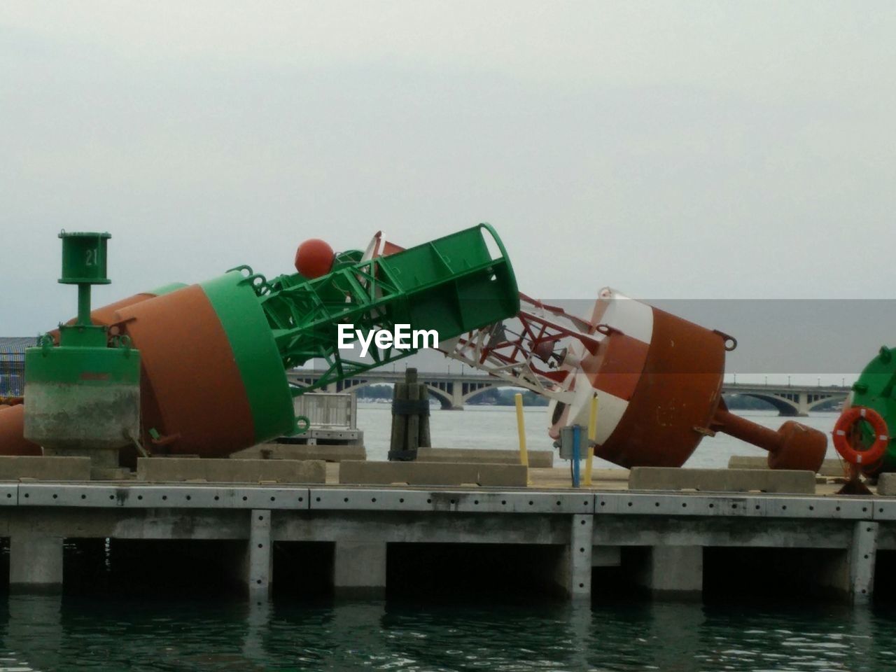 Buoys fallen against sky on pier