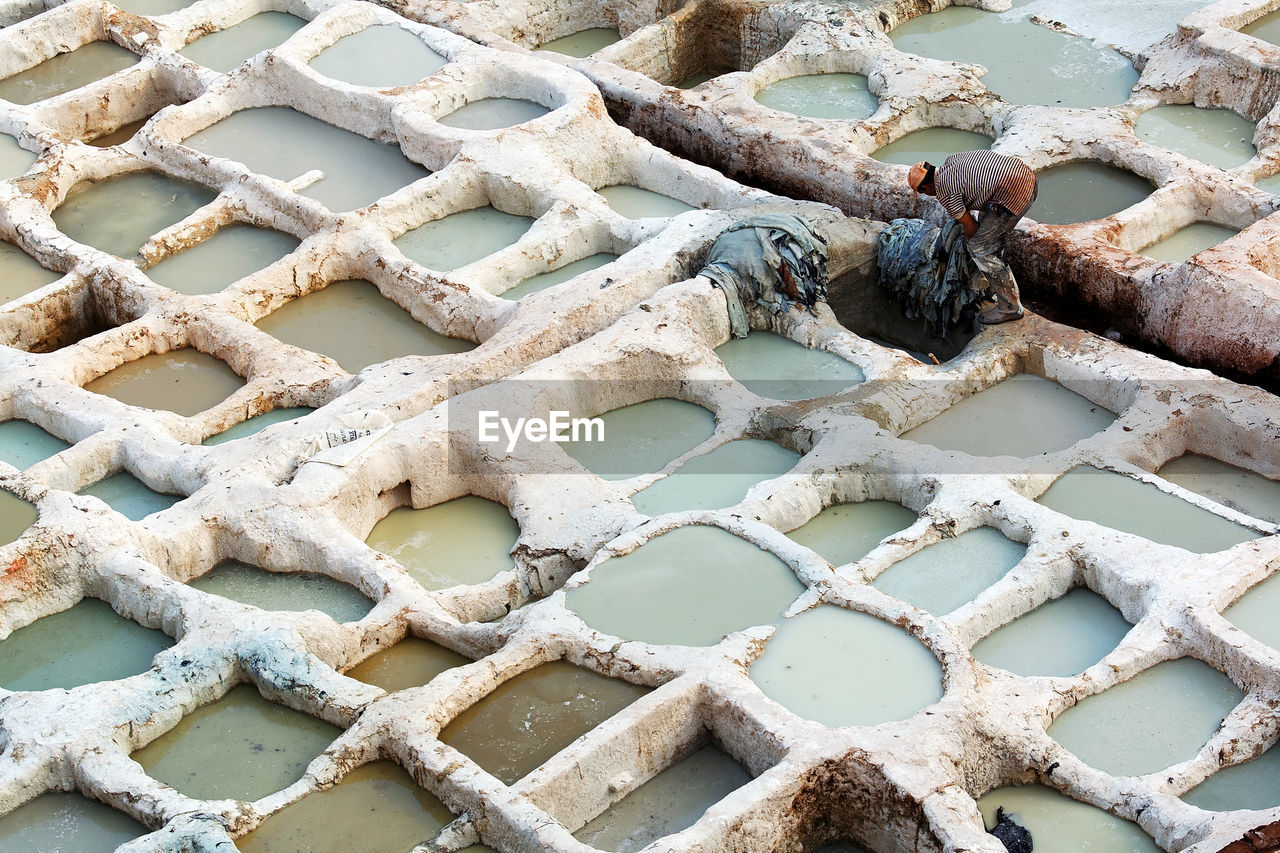 High angle view of man working at the tannery