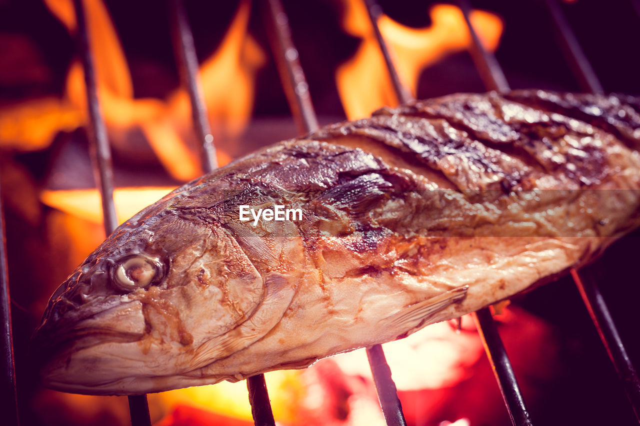 CLOSE-UP OF SEAFOOD ON BARBECUE GRILL