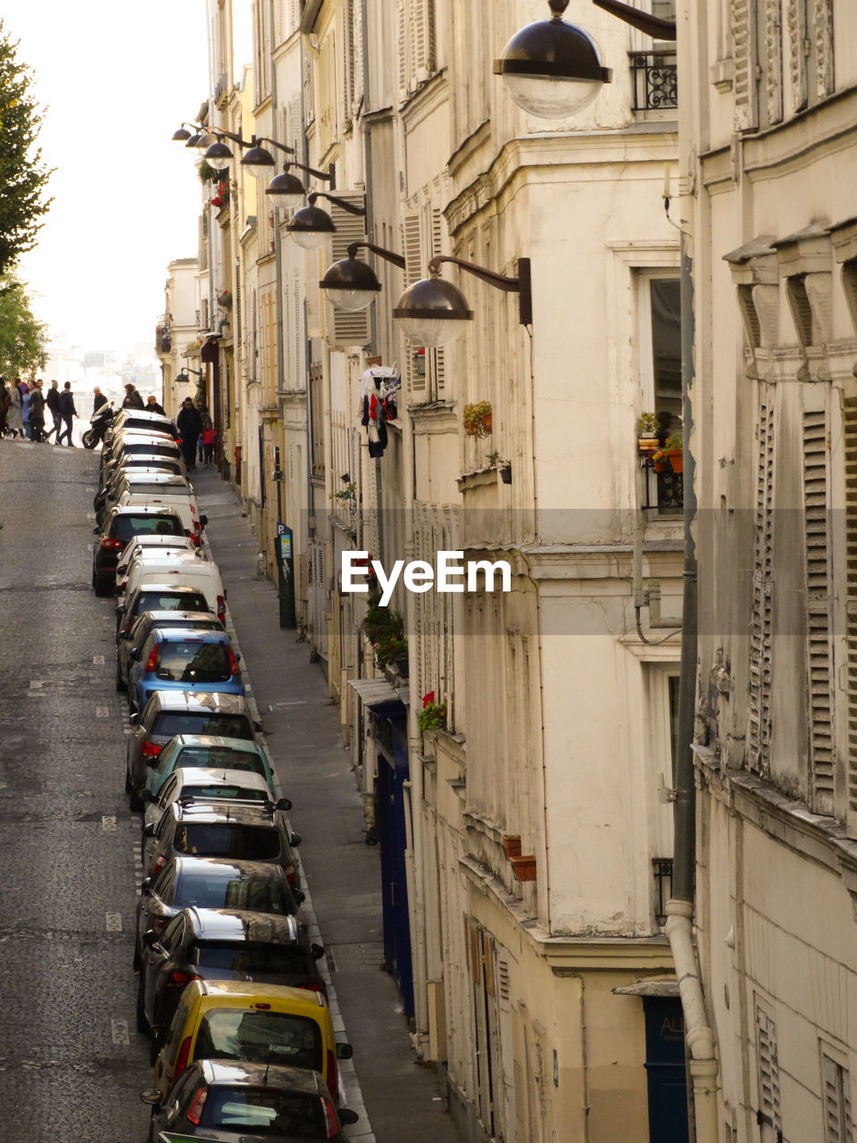 Vehicles on road amidst buildings in city