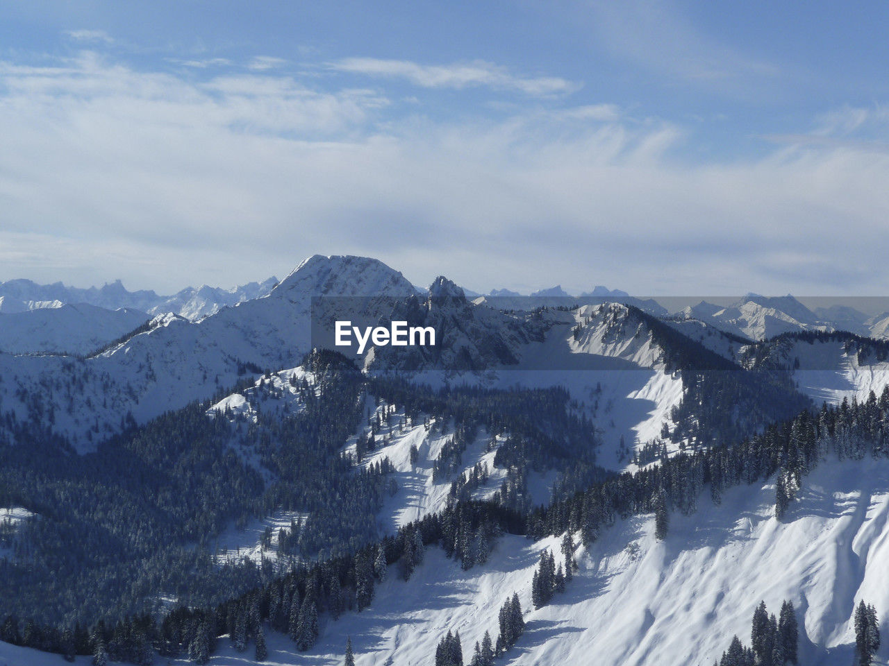 snow, winter, cold temperature, mountain, scenics - nature, beauty in nature, mountain range, environment, snowcapped mountain, sky, landscape, nature, cloud, tranquil scene, tranquility, no people, piste, tree, day, non-urban scene, travel destinations, ridge, land, travel, forest, plant, winter sports, outdoors, white, mountain peak, pine tree, idyllic, sports, blue, coniferous tree, tourism, resort