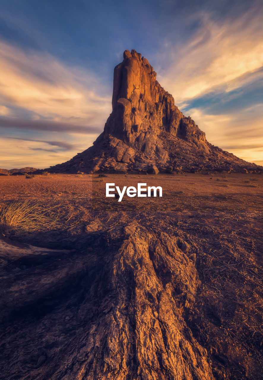 Scenic view of landscape against cloudy sky