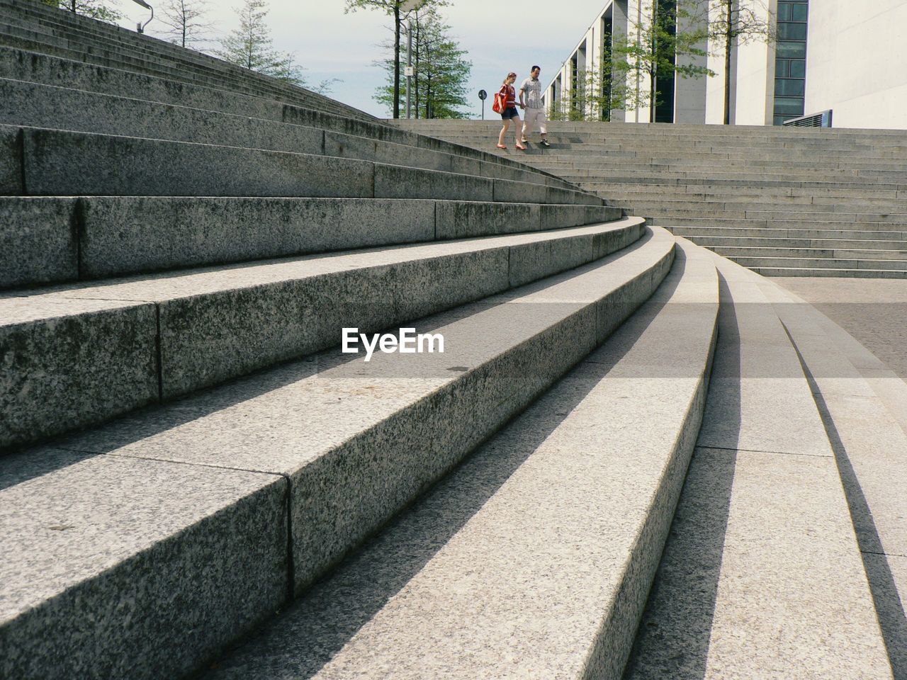 REAR VIEW OF WOMAN ON STEPS