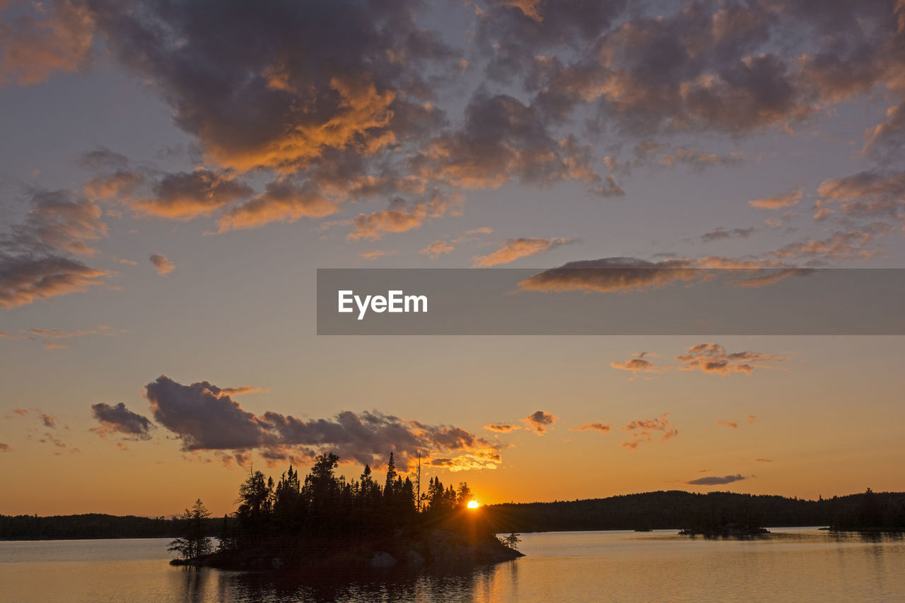 Dramatic sunset on saganagons lake in quetico provincial park