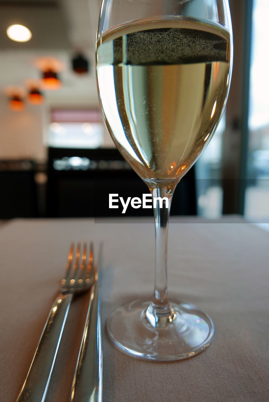 Wineglass on table at restaurant