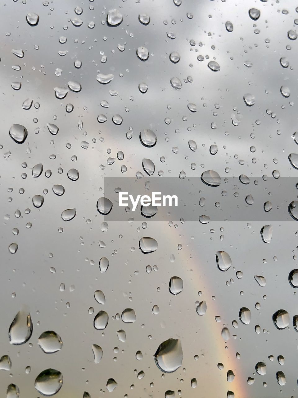 FULL FRAME SHOT OF WATER DROPS ON GLASS WINDOW