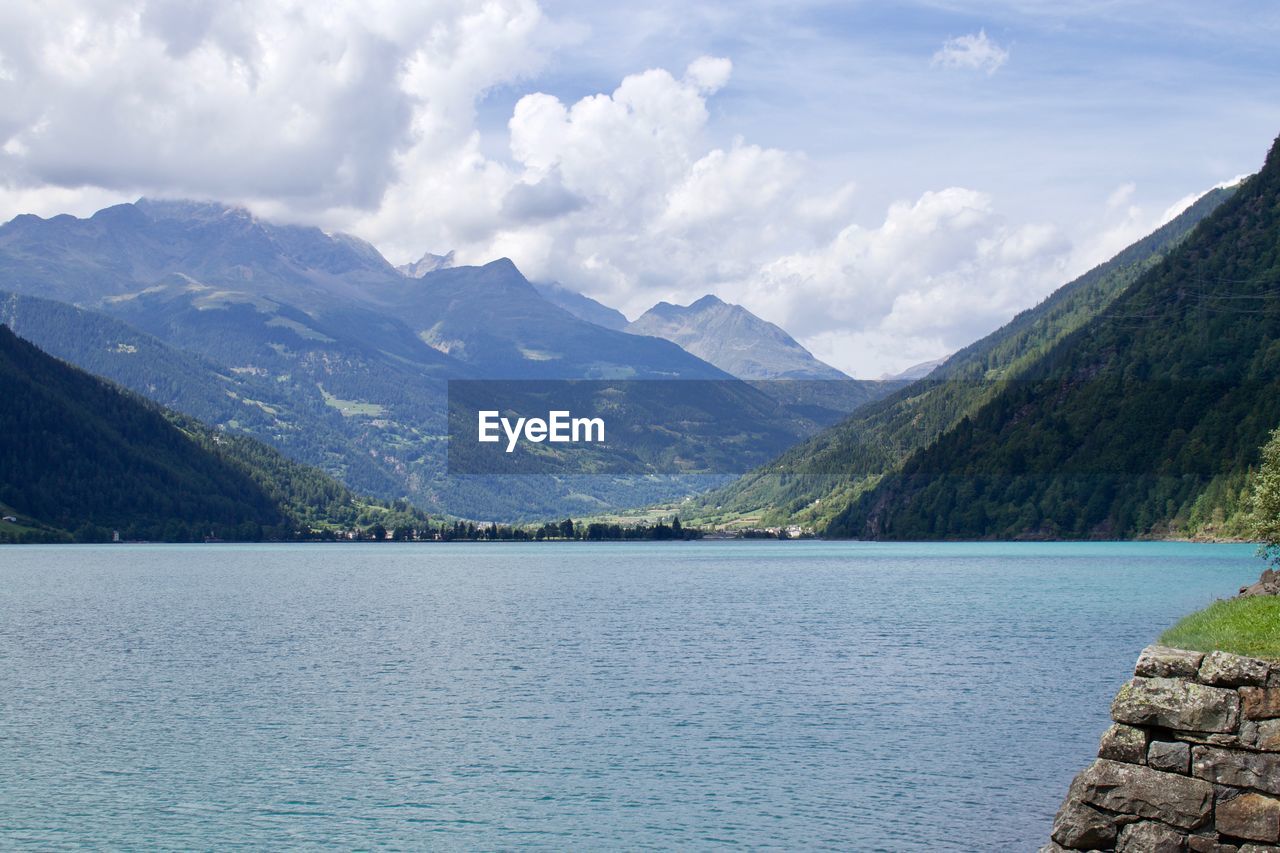 Scenic view of lake and mountains against sky