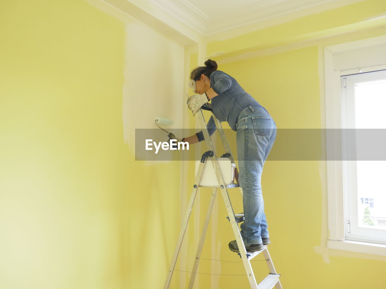 Side view of  woman working at home