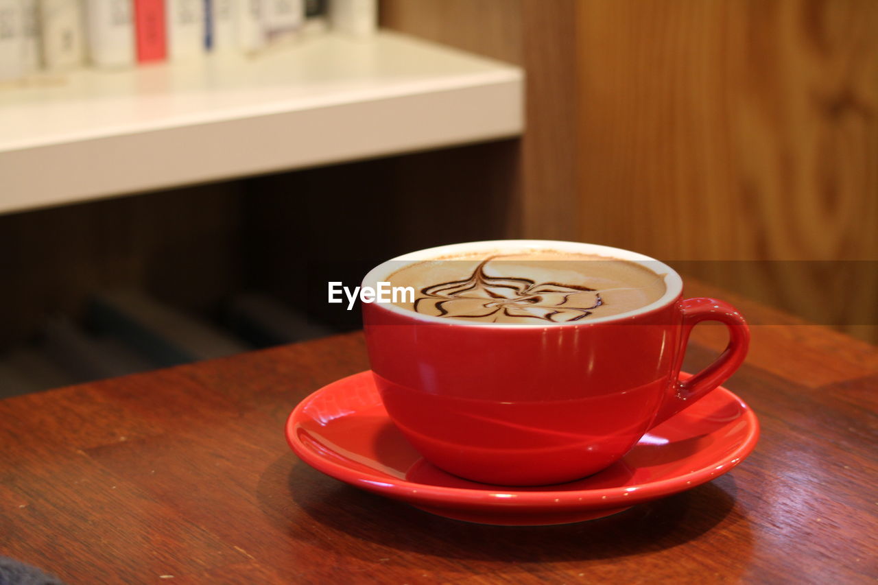 CLOSE-UP OF COFFEE SERVED ON TABLE