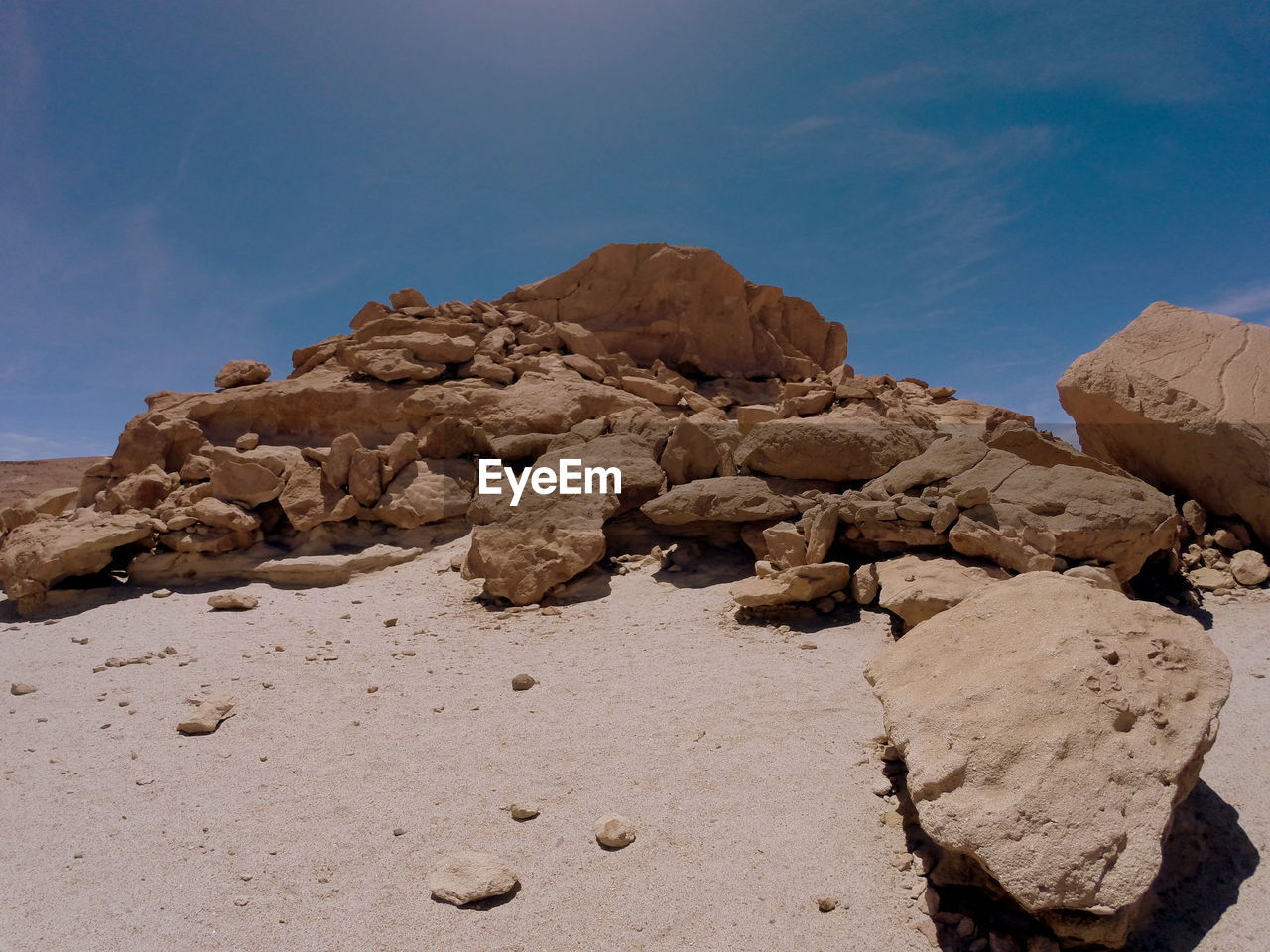 Rock formations on desert against sky