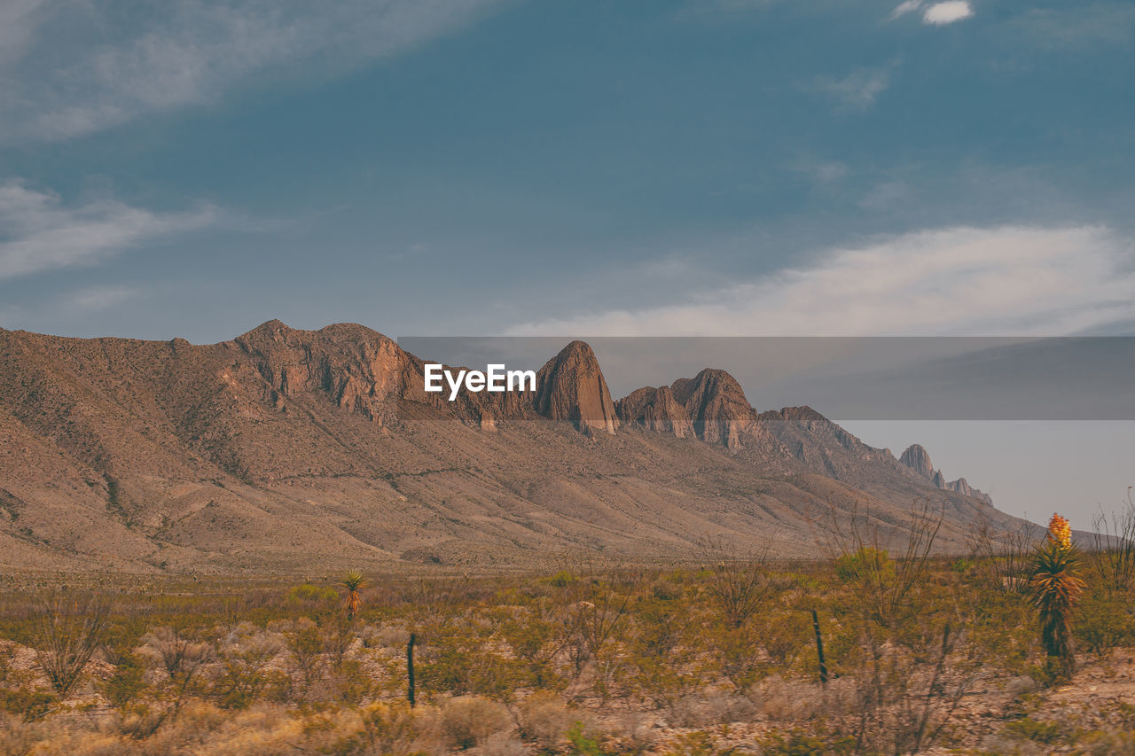 Scenic view of rocky mountains against sky