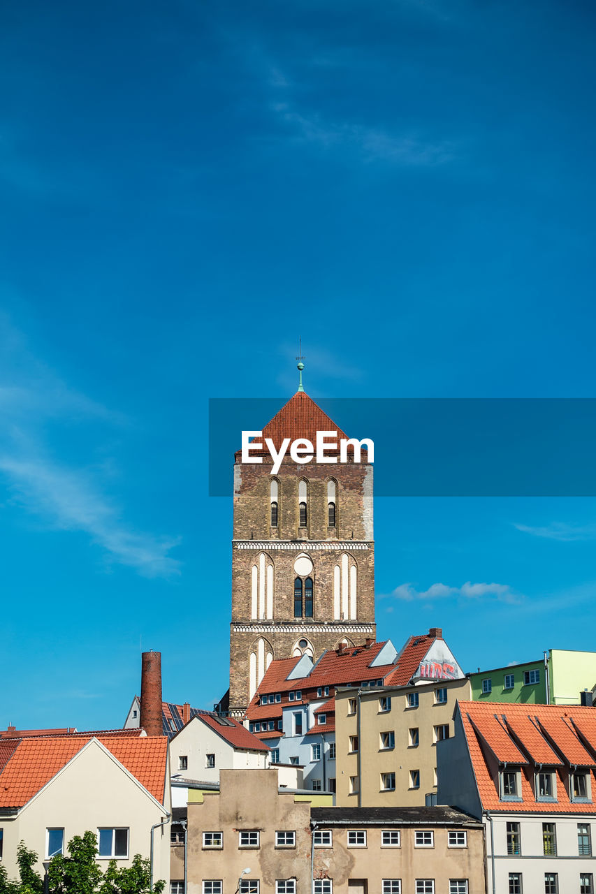 Low angle view of buildings against blue sky