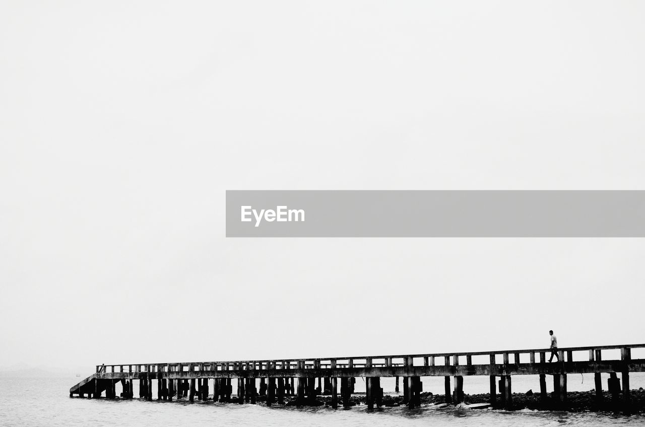 High angle view of pier over sea against clear sky