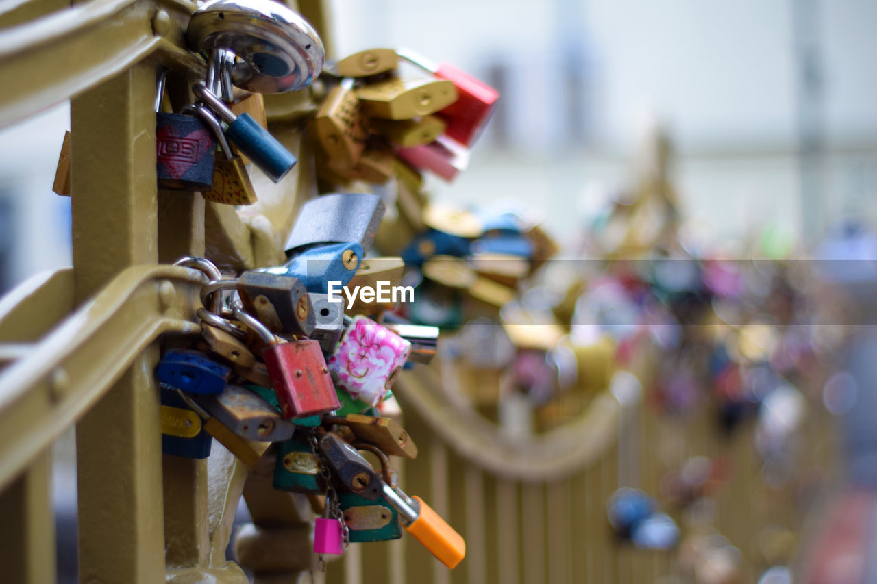 Close-up of padlocks on railing