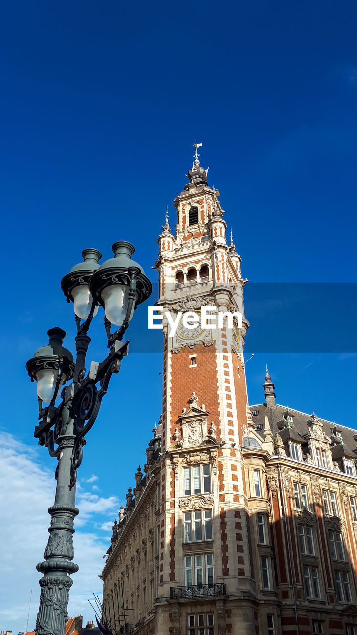 Low angle view of clock tower against sky