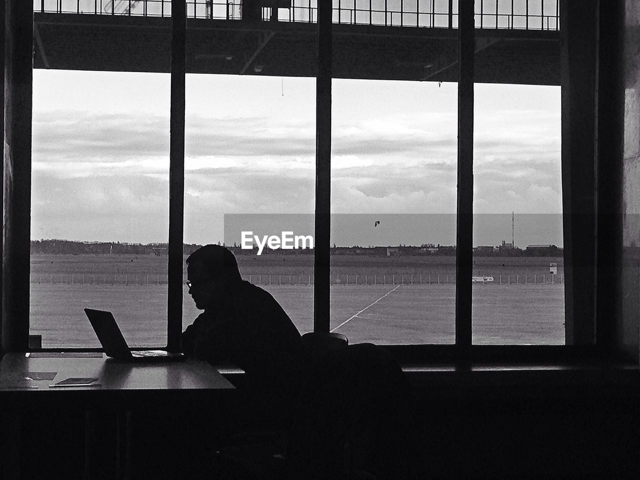 VIEW OF PEOPLE LOOKING THROUGH WINDOW