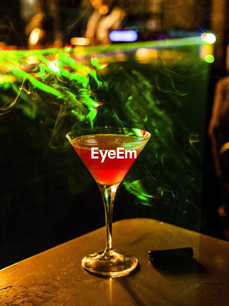 Martini on table at night