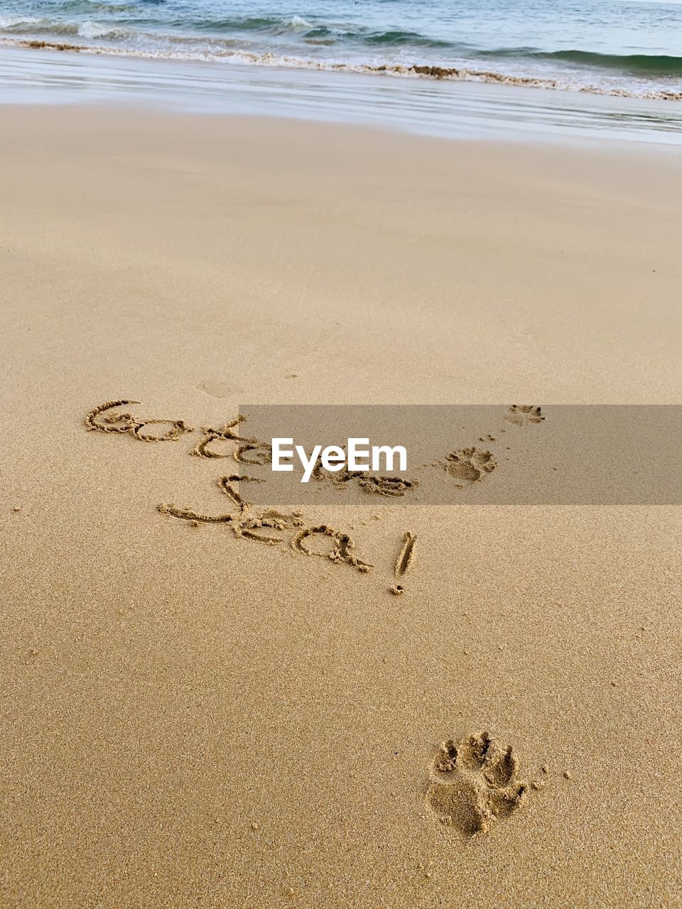 HIGH ANGLE VIEW OF TEXT WRITTEN ON BEACH