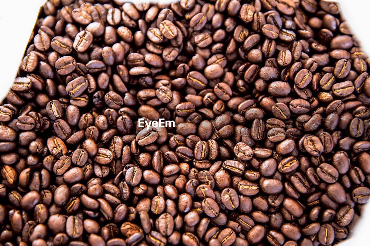 HIGH ANGLE VIEW OF COFFEE BEANS IN BACKGROUND