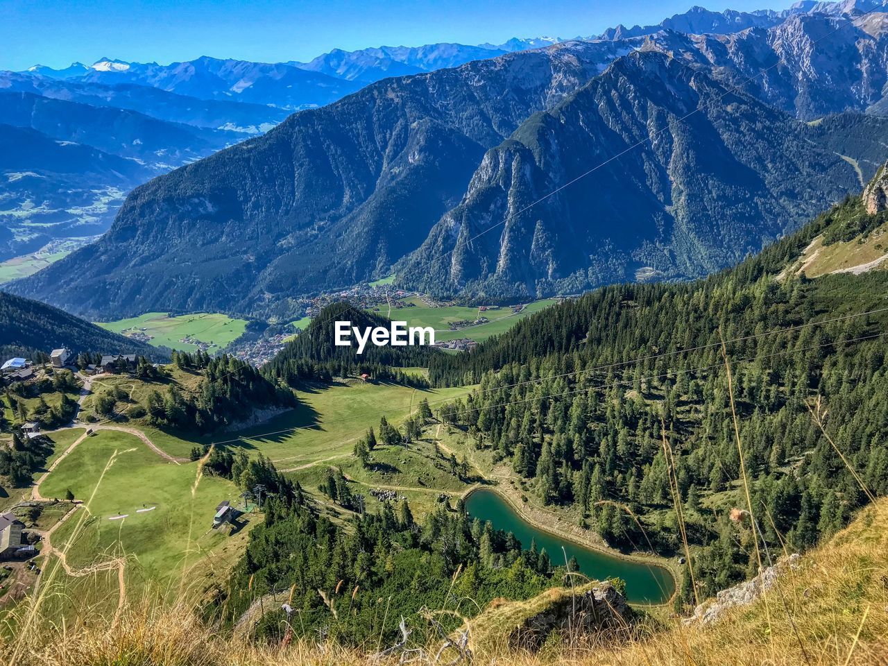 Scenic view of landscape and mountains against sky