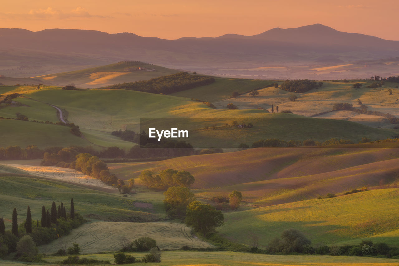 Scenic view of landscape against sky during sunset