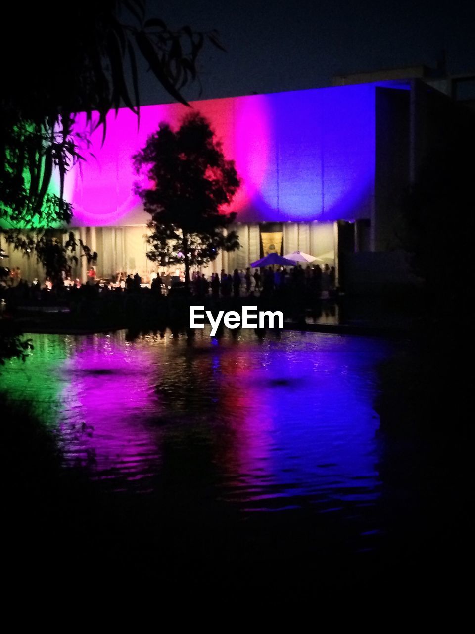 VIEW OF ILLUMINATED BUILDINGS AT NIGHT