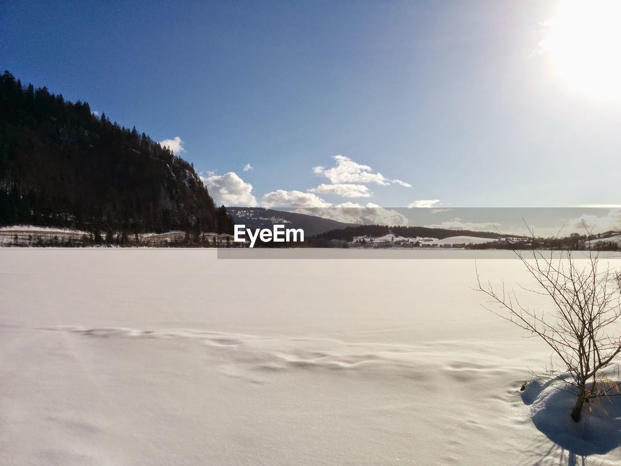 Scenic view of landscape against sky during winter