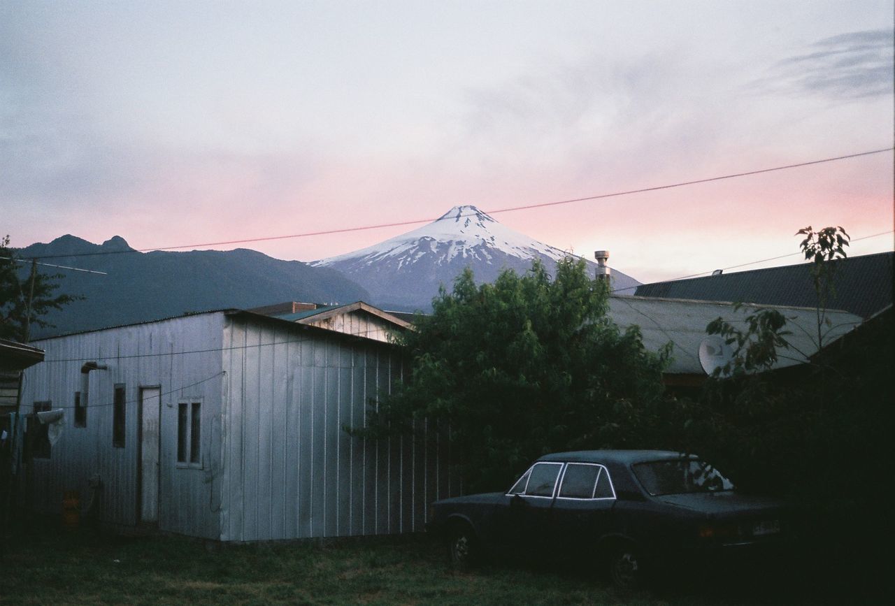 Cars on mountain against sky