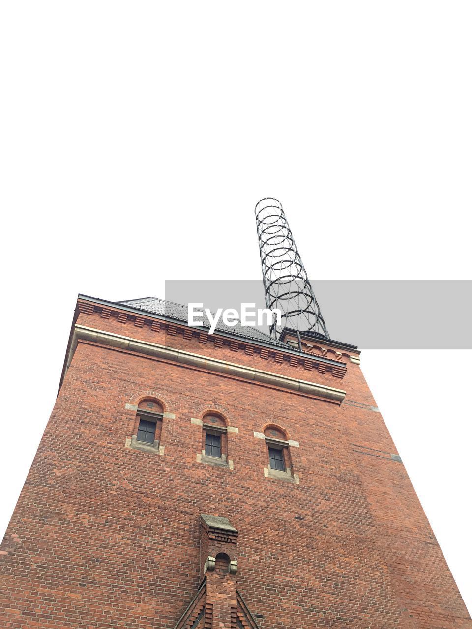 Low angle view of brick wall industry building against clear sky in hafencity