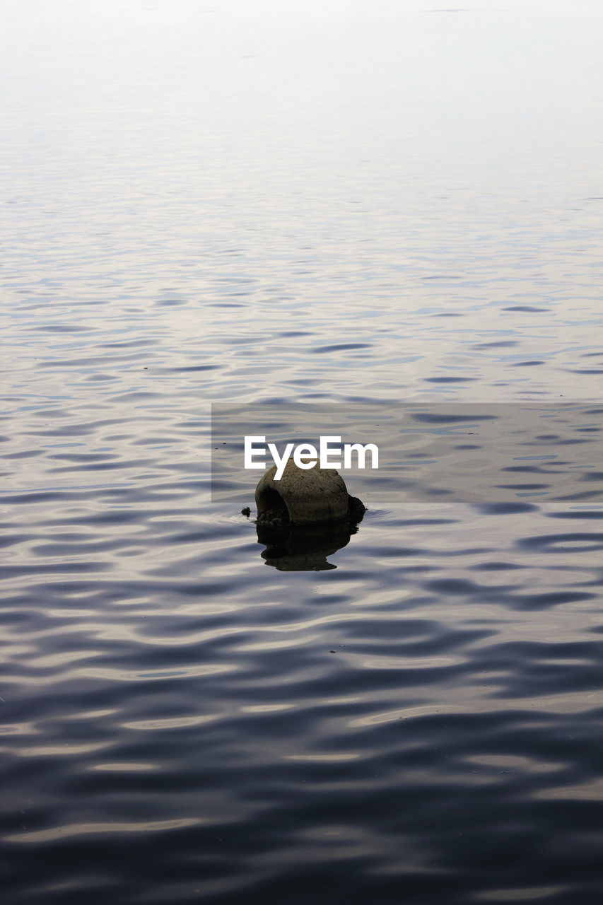 High angle view of buoy on lake during sunset