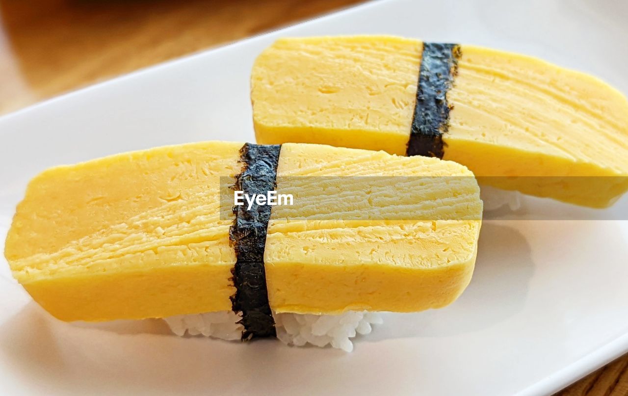 Close-up of tamago, a sweet egg sushi in plate