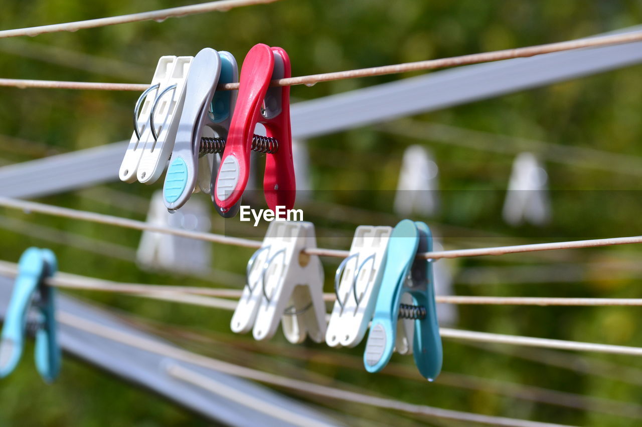 Close-up of clothes hanging on rope