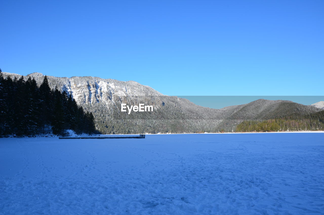 SNOWCAPPED MOUNTAINS AGAINST CLEAR BLUE SKY