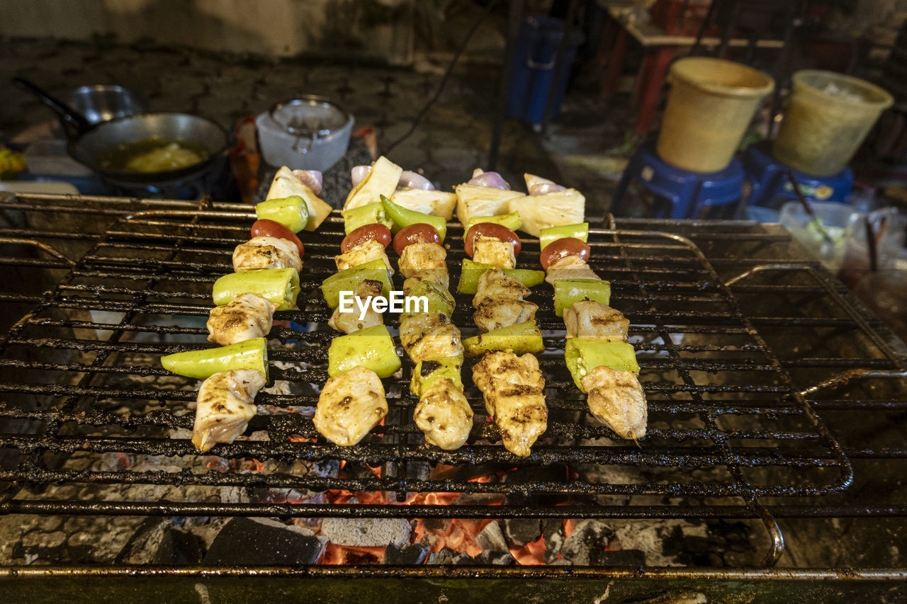 food, food and drink, freshness, barbecue, barbecue grill, grilled, grilling, heat, cooking, fast food, meat, healthy eating, dish, cuisine, wellbeing, skewer, preparing food, no people, street food, high angle view, outdoors, grid, day, meal, grate, metal, burning