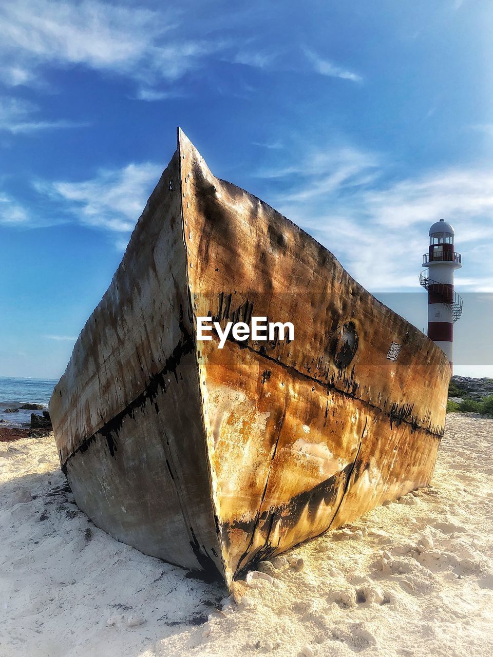 ABANDONED BOAT ON BEACH