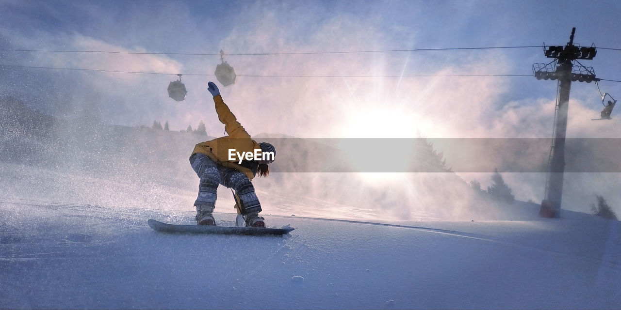 MAN WITH UMBRELLA ON SNOW