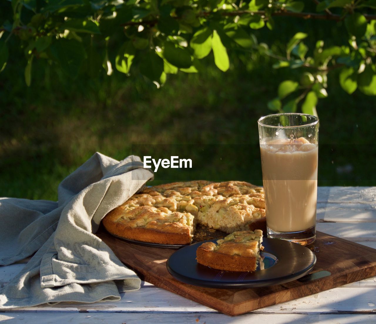 High angle view of rhubarb pie served on table in the garden