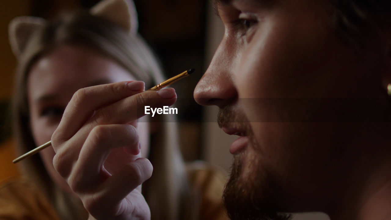 Close-up of man smoking