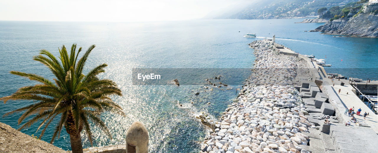 Pier of the touristic harbor of the village of camogli, liguria, italy that faces paradise bay