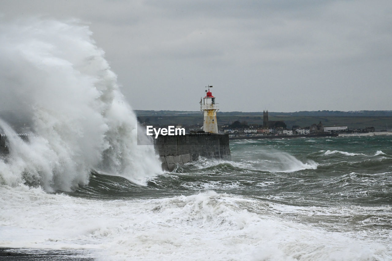 LIGHTHOUSE AGAINST SEA