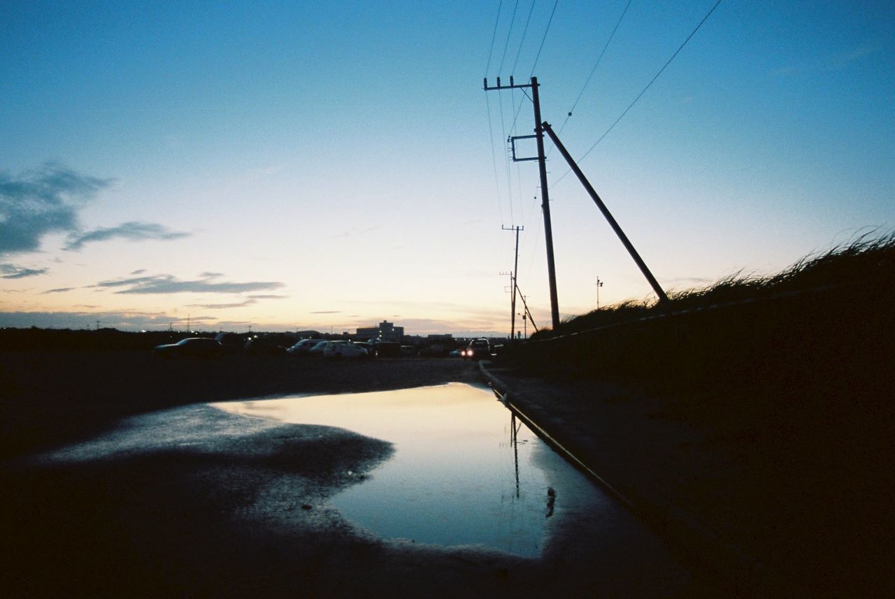 VIEW OF ELECTRICITY PYLON AT SUNSET