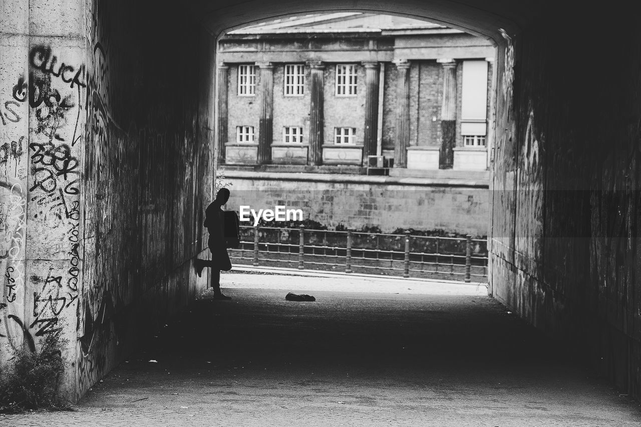 Man standing in tunnel