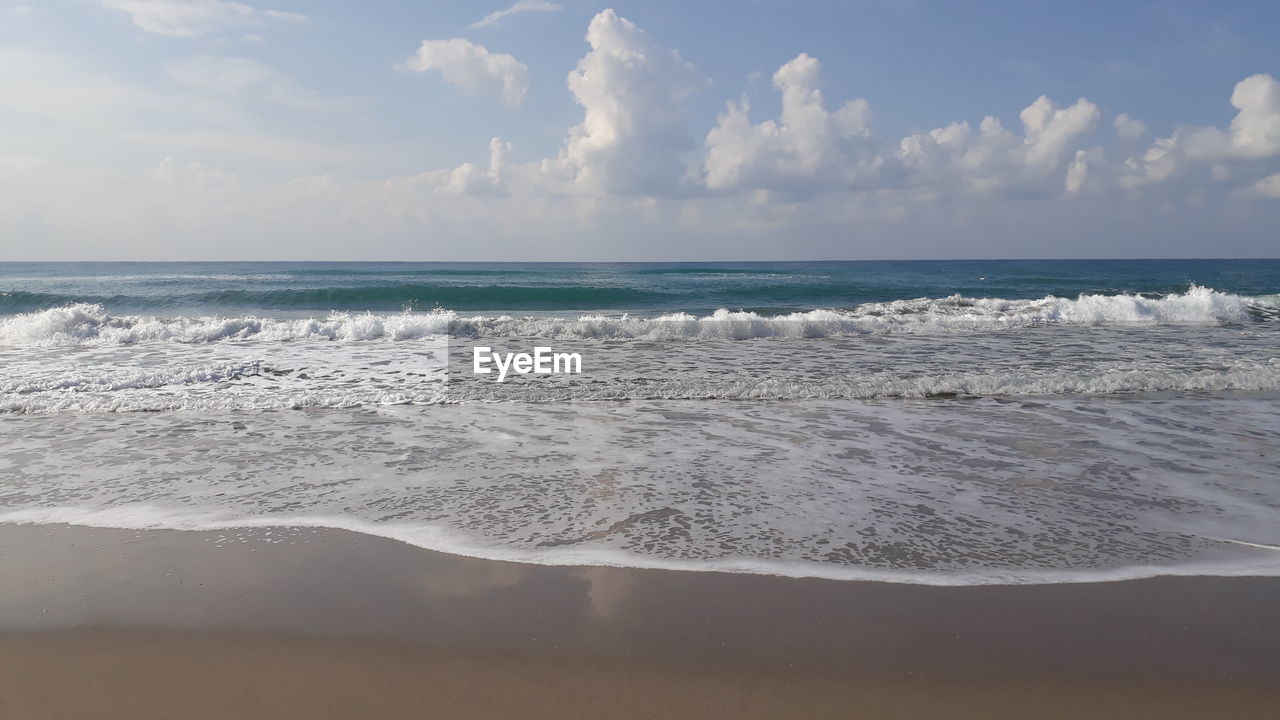 PANORAMIC VIEW OF BEACH AGAINST SKY