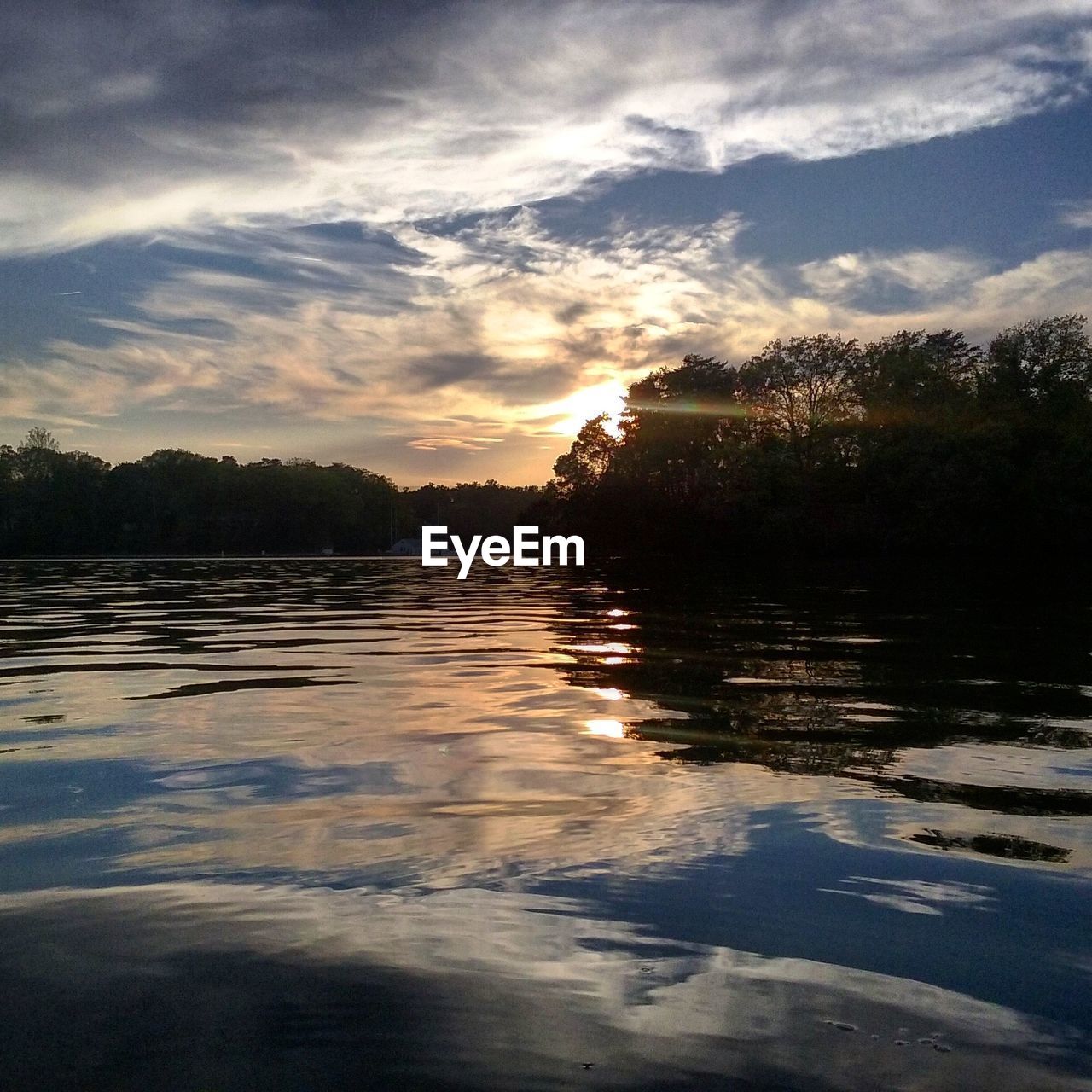 Scenic view of lake at sunset