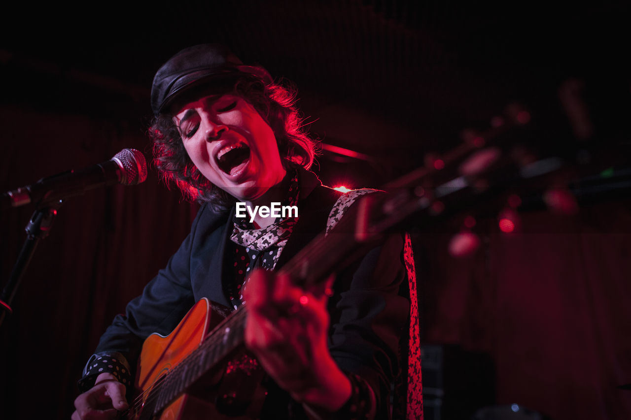 Guitarist performing at a nightclub