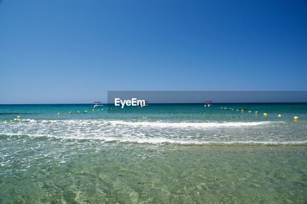 Scenic view of sea against clear sky