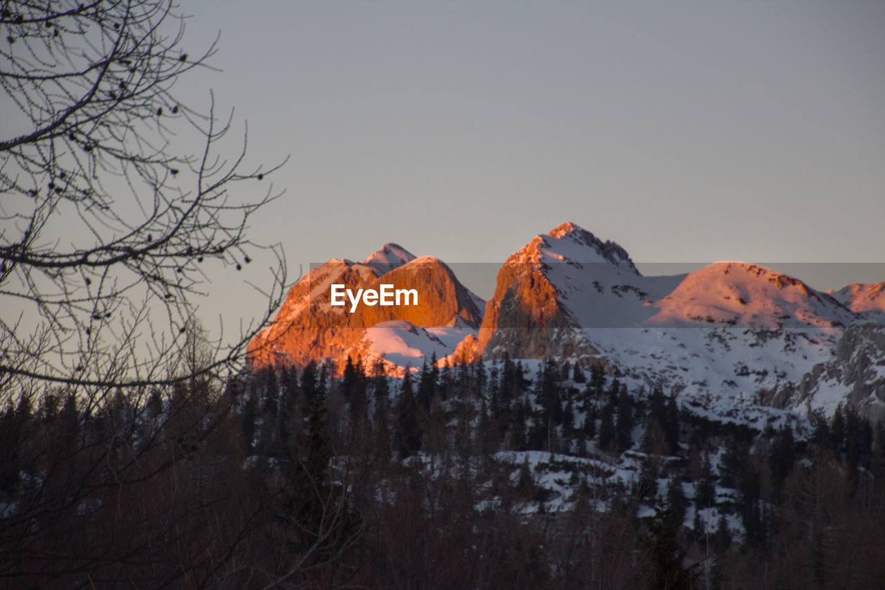 Panoramic view of snowcapped mountains against sky during winter