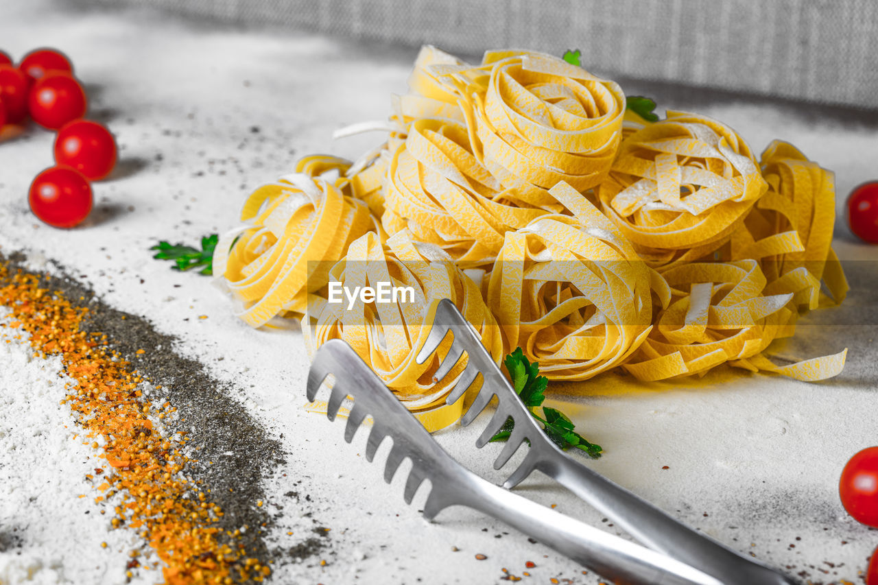 Close-up of pasta and ingredients on table