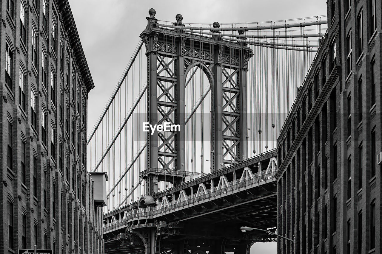 low angle view of bridge in city