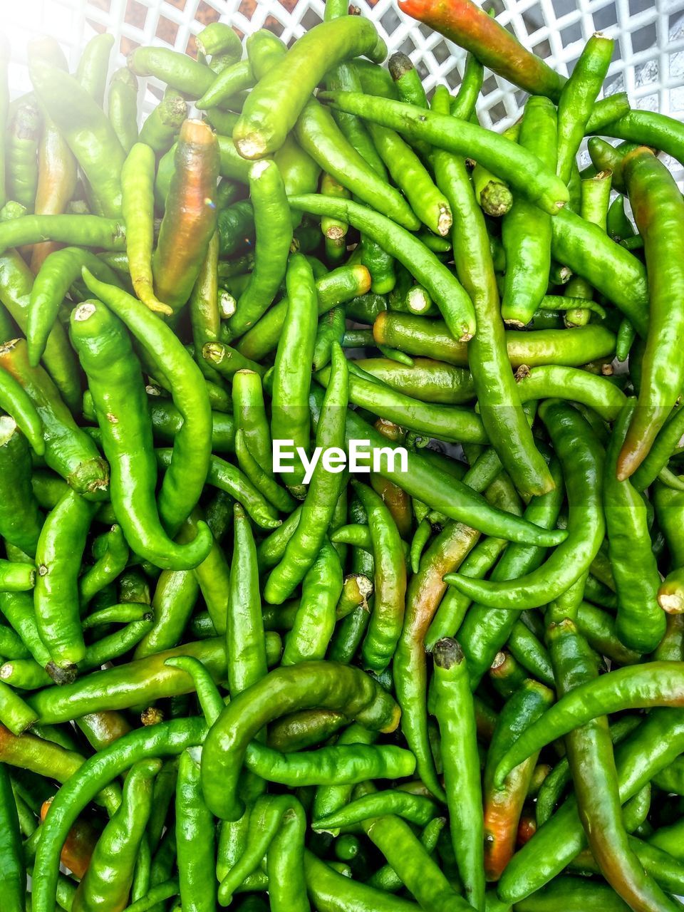 FULL FRAME SHOT OF GREEN CHILI PEPPERS FOR SALE